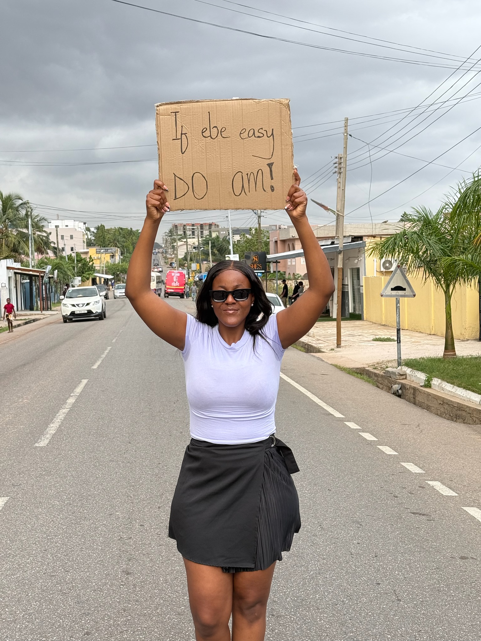 A monochrome product card showing a bottle on a sculpted surface.